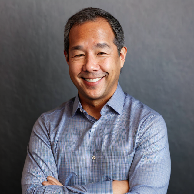 Paolo Narciso smiling, wearing a blue shirt